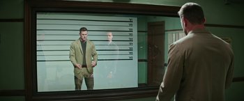 Movie still from “Dog” (2022), directed by Reid Carolin – A man is standing in front of a mirror; Medium shot, Over the shoulder angle
