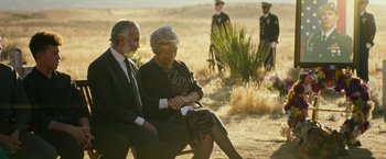 Movie still from “Dog” (2022), directed by Reid Carolin – A man and a woman sitting next to each other on a bench; Wide shot, Over the shoulder angle
