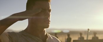 Movie still from “Dog” (2022), directed by Reid Carolin – A person with his hand up to his forehead; Close Up shot, Low angle