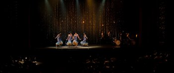 Movie still from “Dreamgirls” (2006), directed by Bill Condon – A group of women are dancing on a stage; Extreme Wide shot, High angle