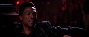 Movie still from “Dreamgirls” (2006), directed by Bill Condon – A man in a black jacket is looking at the camera; Close Up shot, Low angle