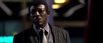 Movie still from “Dreamgirls” (2006), directed by Bill Condon – A person wearing a suit and tie; Close Up shot, Low angle