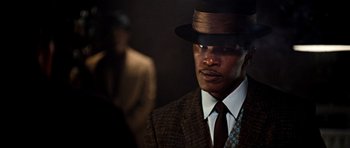 Movie still from “Dreamgirls” (2006), directed by Bill Condon – A man wearing a suit and a hat; Close Up shot, Low angle