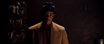 Movie still from “Dreamgirls” (2006), directed by Bill Condon – A man wearing a hat and a jacket; Close Up shot, Low angle