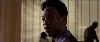 Movie still from “Dreamgirls” (2006), directed by Bill Condon – A person wearing a blue shirt; Close Up shot, Over the shoulder angle