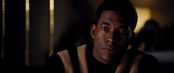 Movie still from “Dreamgirls” (2006), directed by Bill Condon – A person wearing a black shirt; Close Up shot, Over the shoulder angle