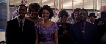 Movie still from “Dreamgirls” (2006), directed by Bill Condon – A group of women standing next to each other in a room; Medium shot, High angle