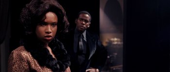 Movie still from “Dreamgirls” (2006), directed by Bill Condon – A man and a woman standing next to each other; Close Up shot, Over the shoulder angle
