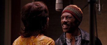 Movie still from “Dreamgirls” (2006), directed by Bill Condon – A man and a woman in front of a microphone; Close Up shot, Over the shoulder angle