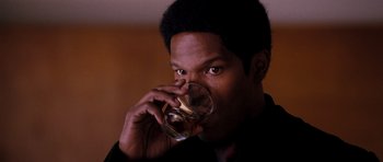 Movie still from “Dreamgirls” (2006), directed by Bill Condon – A person drinking a glass of water; Close Up shot, High angle