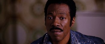 Movie still from “Dreamgirls” (2006), directed by Bill Condon – A person wearing a jacket; Close Up shot, High angle