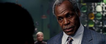 Movie still from “Dreamgirls” (2006), directed by Bill Condon – An older man wearing a suit and tie; Close Up shot, Over the shoulder angle