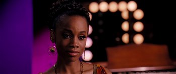 Movie still from “Dreamgirls” (2006), directed by Bill Condon – A person wearing a dress; Close Up shot, Over the shoulder angle