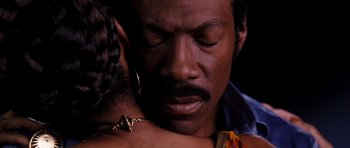 Movie still from “Dreamgirls” (2006), directed by Bill Condon – A person holding a person's face; Close Up shot, High angle