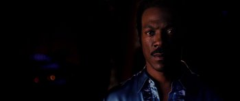 Movie still from “Dreamgirls” (2006), directed by Bill Condon – A person wearing a blue shirt; Close Up shot, Low angle