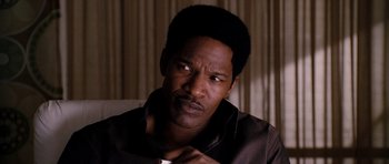 Movie still from “Dreamgirls” (2006), directed by Bill Condon – A person sitting in a chair; Close Up shot, High angle