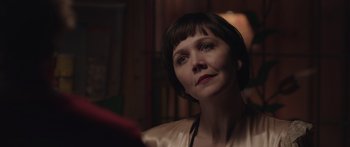 Movie still from “Frank” (2014), directed by Lenny Abrahamson – A person with short hair; Close Up shot, Over the shoulder angle