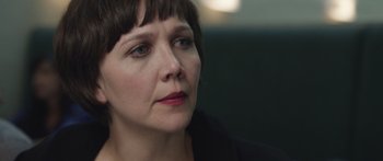 Movie still from “Frank” (2014), directed by Lenny Abrahamson – A person with short brown hair; Close Up shot, Over the shoulder angle