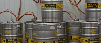 Movie still from “Drinking Buddies” (2013), directed by Joe Swanberg – A stack of beer kegs in a room; Extreme Close Up shot, Overhead angle