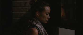 Movie still from “Drinking Buddies” (2013), directed by Joe Swanberg – A person wearing a scarf; Close Up shot, Over the shoulder angle