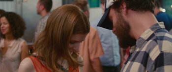 Movie still from “Drinking Buddies” (2013), directed by Joe Swanberg – A young girl and an older man talking to each other; Close Up shot, Over the shoulder angle