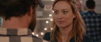 Movie still from “Drinking Buddies” (2013), directed by Joe Swanberg – A man and a woman looking at one another; Close Up shot, Over the shoulder angle