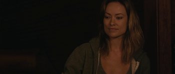 Movie still from “Drinking Buddies” (2013), directed by Joe Swanberg – A woman in a gray hoodie is looking at the camera; Close Up shot, Over the shoulder angle