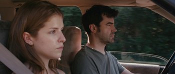 Movie still from “Drinking Buddies” (2013), directed by Joe Swanberg – A man and a woman sitting in the back seat of a car; Close Up shot, Over the shoulder angle