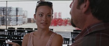 Movie still from “Drinking Buddies” (2013), directed by Joe Swanberg – A man and a woman sitting at a table in a restaurant; Close Up shot, Over the shoulder angle