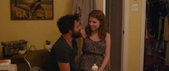 Movie still from “Drinking Buddies” (2013), directed by Joe Swanberg – A man and a woman smiling at each other in front of a mirror; Medium shot, Over the shoulder angle