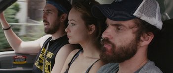 Movie still from “Drinking Buddies” (2013), directed by Joe Swanberg – A group of people sitting next to each other; Close Up shot, Over the shoulder angle