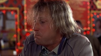 Movie still from “Dumb and Dumber” (1994), directed by Peter Farrelly – A person with long hair; Close Up shot, Low angle