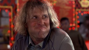 Movie still from “Dumb and Dumber” (1994), directed by Peter Farrelly – A person wearing a jacket; Close Up shot, Low angle
