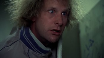 Movie still from “Dumb and Dumber” (1994), directed by Peter Farrelly – A person wearing a jacket; Close Up shot, Low angle