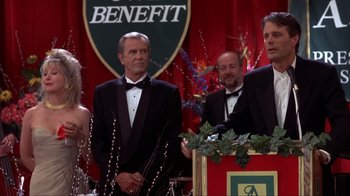 Movie still from “Dumb and Dumber” (1994), directed by Peter Farrelly – A group of men in tuxedos standing next to each other; Medium shot, High angle