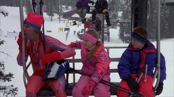 Movie still from “Dumb and Dumber” (1994), directed by Peter Farrelly – A group of people riding on a ski lift; Wide shot, High angle