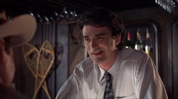 Movie still from “Dumb and Dumber” (1994), directed by Peter Farrelly – A person wearing a shirt and a tie; Close Up shot, Low angle