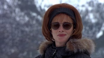 Movie still from “Dumb and Dumber” (1994), directed by Peter Farrelly – A person wearing sunglasses and a jacket; Close Up shot, Low angle