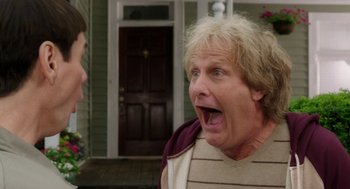 Movie still from “Dumb and Dumber To” (2014), directed by Peter Farrelly – A man with his mouth wide open looking at another man; Close Up shot, Low angle