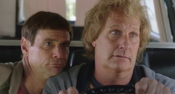 Movie still from “Dumb and Dumber To” (2014), directed by Peter Farrelly – Two men sitting next to each other in a car; Close Up shot, Over the shoulder angle