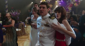 Movie still from “Dumb and Dumber To” (2014), directed by Peter Farrelly – A group of people in formal wear standing in a room; Medium shot, Over the shoulder angle