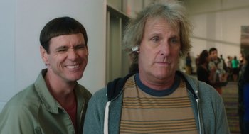 Movie still from “Dumb and Dumber To” (2014), directed by Peter Farrelly – Two men standing next to each other in a room; Close Up shot, Over the shoulder angle
