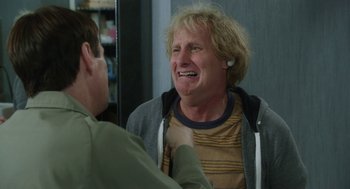Movie still from “Dumb and Dumber To” (2014), directed by Peter Farrelly – A man is laughing with another man in front of a mirror; Close Up shot, Over the shoulder angle