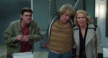 Movie still from “Dumb and Dumber To” (2014), directed by Peter Farrelly – Two men and a woman in a bathroom; Medium shot, Low angle