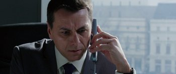 Movie still from “Dying of the Light” (2014), directed by Paul Schrader – A person talking on a cell phone; Close Up shot, Low angle