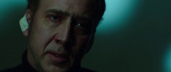 Movie still from “Dying of the Light” (2014), directed by Paul Schrader – A man's face in a dimly - lit room; Close Up shot, Low angle