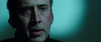 Movie still from “Dying of the Light” (2014), directed by Paul Schrader – A person with a bruise on his face; Close Up shot, Low angle