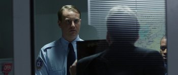 Movie still from “Dying of the Light” (2014), directed by Paul Schrader – A man looking at himself in the mirror; Close Up shot, Over the shoulder angle
