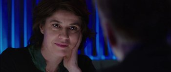 Movie still from “Dying of the Light” (2014), directed by Paul Schrader – A woman's face in front of a mirror; Close Up shot, Over the shoulder angle