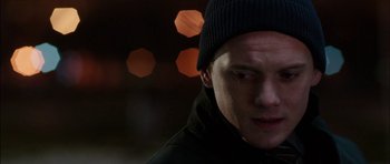 Movie still from “Dying of the Light” (2014), directed by Paul Schrader – A person wearing a hat; Close Up shot, Over the shoulder angle